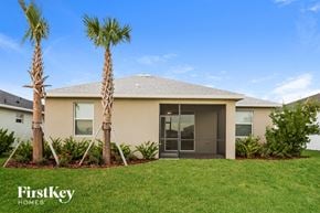 Babcock Ranch house for rent - a home with two palm trees in front of it