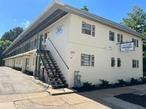 Louisville apartment for rent - A white building with a sign that says "Oakville Apartments" on it.