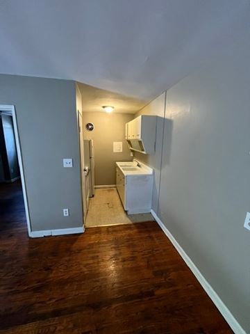 Louisville apartment for rent - A kitchen area with a white fridge and a white sink.