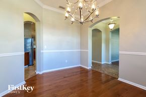 Jacksonville house for rent - a empty dining room with a chandelier