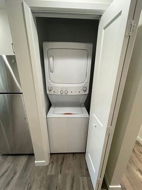 Sacramento apartment for rent - A white oven and microwave are installed in a kitchen.