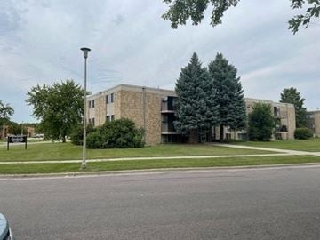 Fargo apartment for rent - a large brick building on the side of a street