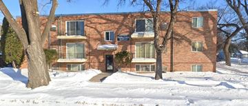 Moorhead apartment for rent - a red brick apartment building in the snow