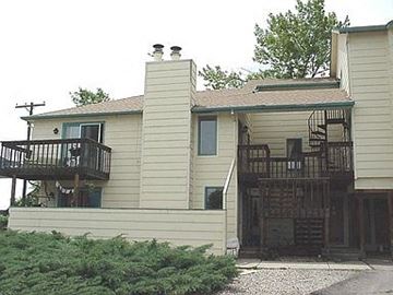 Boulder apartment for rent - A house with a balcony and a staircase leading to the second floor.