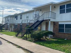 El Campo apartment for rent - a building with stairs and a sidewalk in front of it