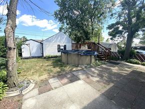 Hammond house for rent - a backyard with a shed and a hot tub in the yard