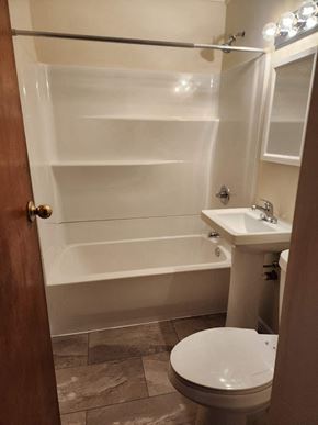 Hammond house for rent - a bathroom with a toilet and a sink and a bath tub
