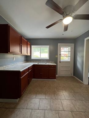 Mount Oliver house for rent - an empty kitchen with a ceiling fan