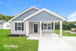 Winston Salem house for rent - A modern house with a grey and white exterior is for sale by FirstKey Homes.