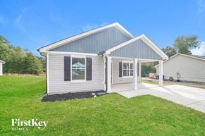 Winston Salem house for rent - A modern house with a grey and white exterior and a large front yard.