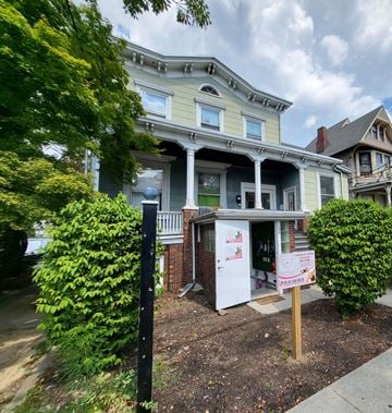 Peekskill apartment for rent - a house with a white sign in front of it