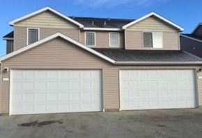 Stanley apartment for rent - A house with two garages is shown in the image.