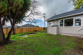 Lemon Grove house for rent - A house with a grey roof and a brown fence.