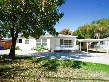 Lemon Grove house for rent - A white house with a tree in front of it.