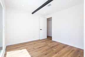 San Diego house for rent - a living room with white walls and wood floors