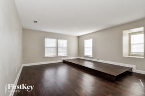 Jacksonville house for rent - an empty living room with hardwood floors and a yoga mat