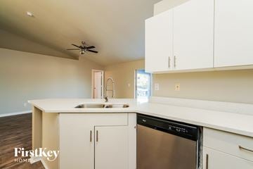 Cape Coral house for rent - A kitchen with a dishwasher and a sink.
