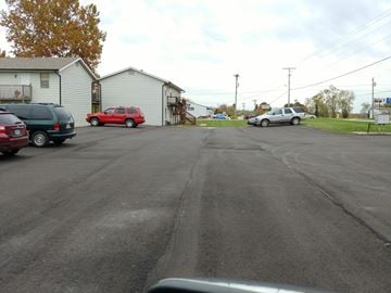 Warrensburg apartment for rent - a city street with cars parked on the side of it
