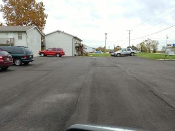 Warrensburg apartment for rent - a city street with cars parked on the side of it