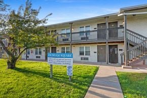 Louisville apartment for rent - A sign in front of a building reads "Oldham Square".