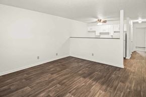 Louisville apartment for rent - A room with wooden flooring and white walls.
