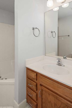 Louisville apartment for rent - A bathroom with a white sink and a mirror.