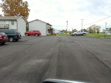 Warrensburg apartment for rent - a city street with cars parked on the side of it