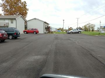 Warrensburg apartment for rent - a city street with cars parked on the side of it