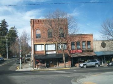 Pullman apartment for rent - A red brick building with a sign that says "McDonald's" on it.