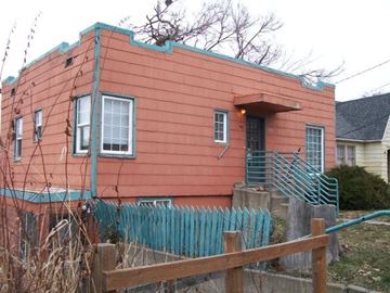 Pullman apartment for rent - a red house with a fence in front of it