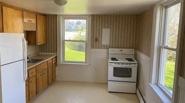 Pictou apartment for rent - a kitchen with a stove and a refrigerator and a window