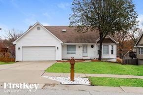 Kansas City house for rent - a white house with a fire hydrant on the sidewalk