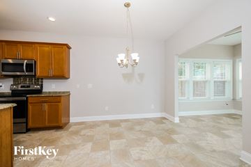 Lexington house for rent - A kitchen with wooden cabinets and a tiled floor.