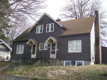 Pullman apartment for rent - a house with black siding on a hill
