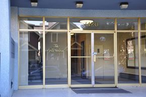 Vancouver apartment for rent - The Hardest store front with a glass door and a sign above it.