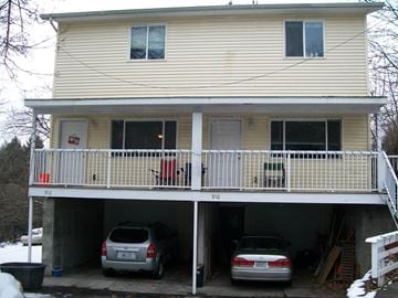 Pullman apartment for rent - A two-car garage is attached to a house.