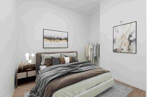 Winnipeg apartment for rent - a bedroom with a bed and pictures on the wall