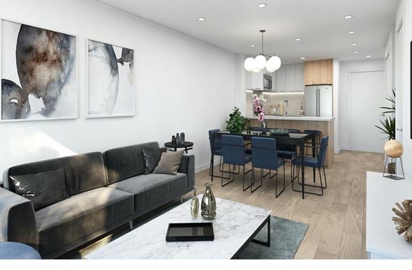 Kelowna apartment for rent - A modern living room with a grey sofa and a dining table set up.