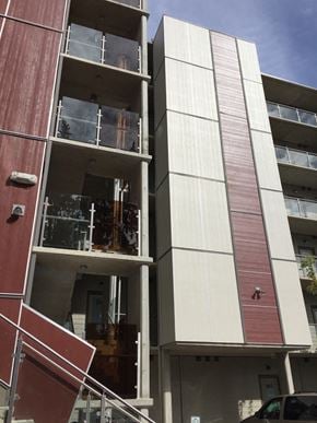 Langford apartment for rent - A red and white building with a car parked in front.