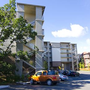 Langford apartment for rent - A car is parked in a parking lot in front of a building.