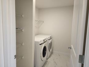Edmonton apartment for rent - a white washer and dryer in a white laundry room