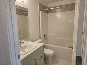 Edmonton apartment for rent - a bathroom with a sink toilet and shower