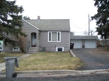 Pullman apartment for rent - A grey house with a grey trash bin in front of it.
