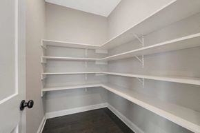 Lake Elmo house for rent - A room with white shelves and a black door.