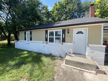 Clinton house for rent - a white brick house with a white front door