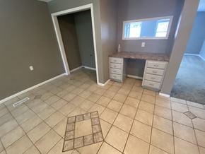 Clinton house for rent - a large bathroom with tiled flooring and a vanity with a window