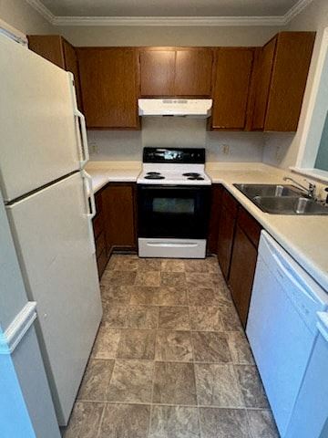 Garner apartment for rent - a kitchen with a stove refrigerator and a sink
