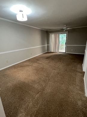 Garner apartment for rent - an empty living room with carpet and a window
