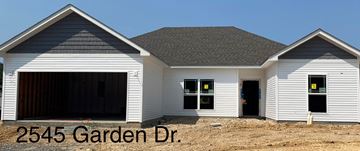 Benton house for rent - a new house with a garage and a dirt