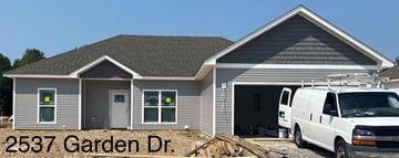 Benton house for rent - a house being remodeled with a van in front of it